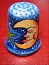 Uruguay  Moon Porcelain. blue porcelain thimble with a drawing of a moon. Uploaded by Winny